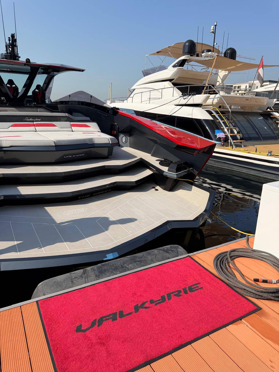 Valkyrie’s aft deck with lounge seating and red accents