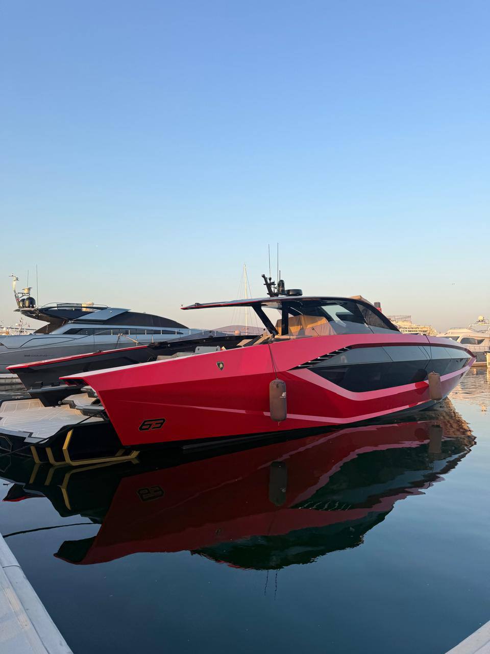 The red Valkyrie yacht reflected in the water